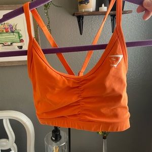 Gymshark orange scrunch sports bra with crisscross back size small